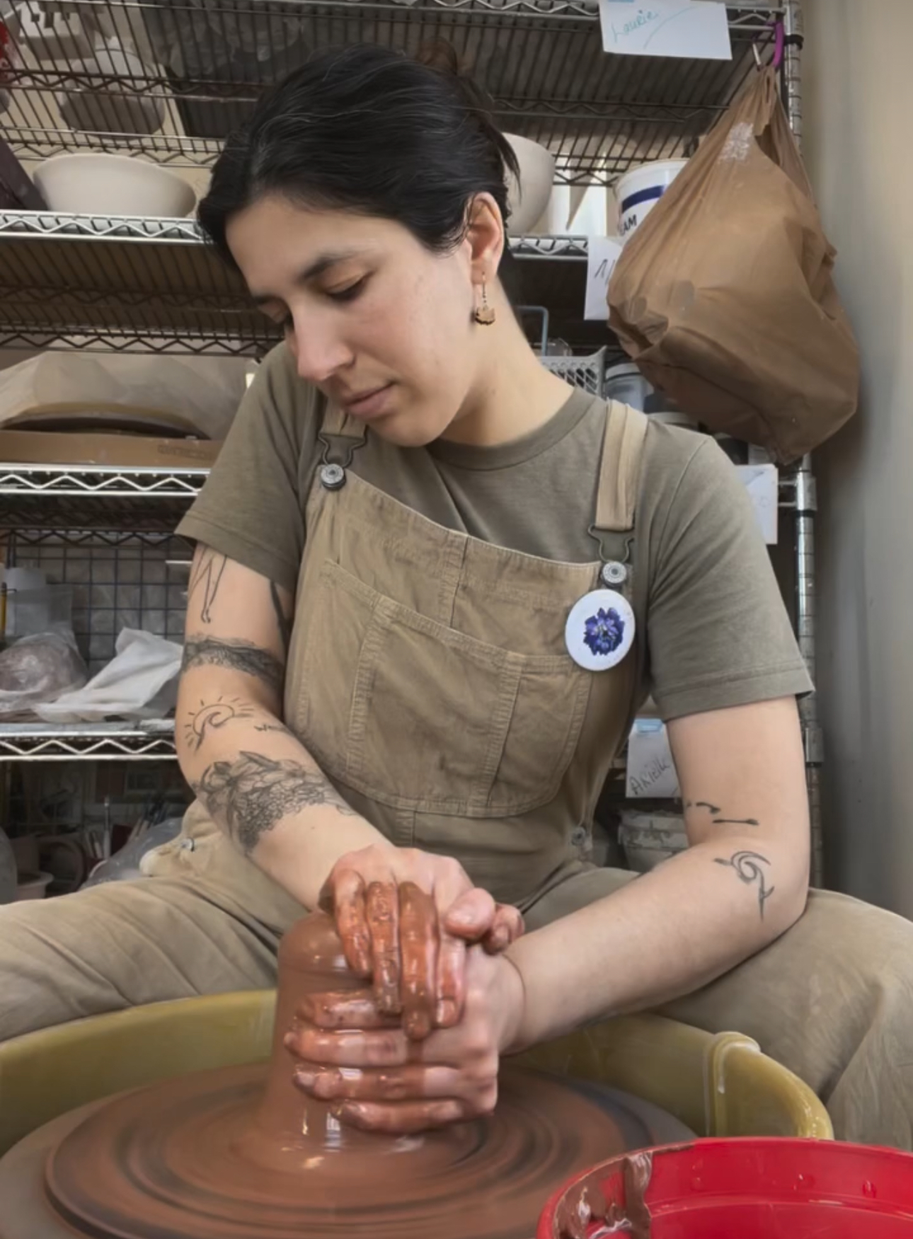 AJ, pottery artist from Waterbury, Vermont working at pottery wheel